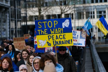 Several thousand people take part in a demonstration for the first anniversary of the Russian invasion in Brussels, Belgium on Feb. 25, 2023.