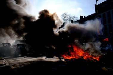 Tires are burning during a protest of farmers from Belgium's northern region of Flanders, against a new regional government plan to limit nitrogen emissions, in Brussels, Belgium March 3, 2023.