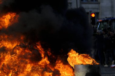 Tires are burning during a protest of farmers from Belgium's northern region of Flanders, against a new regional government plan to limit nitrogen emissions, in Brussels, Belgium March 3, 2023.