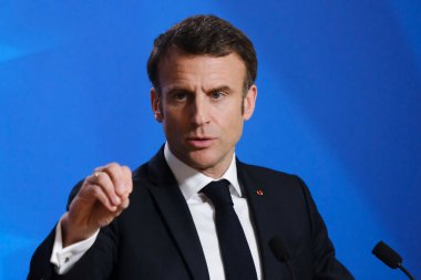 French President Emmanuel Macron speaks during a press conference after a EU Summit, at the EU headquarters in Brussels, Belgium on March 24, 2023. clipart
