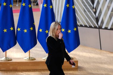 Italy's Prime Minister Giorgia Meloni arrives for a EU Summit, at the EU headquarters in Brussels, on March 23, 2023. clipart