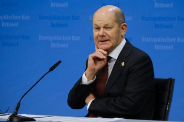 Germany's Chancellor Olaf Scholz speaks during a press conference after a EU Summit, at the EU headquarters in Brussels, on March 24, 2023. clipart