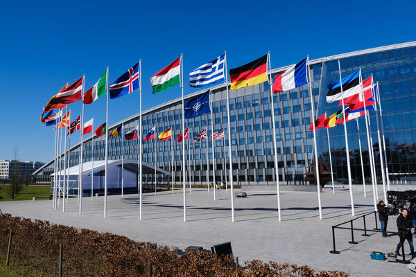 The national flags of countries member of the NATO fly outside the organisation headquarters in Brussels, Belgium on April 3, 2023.