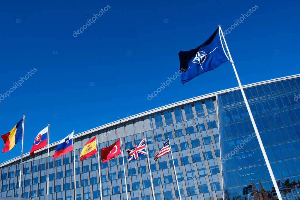 The national flags of countries member of the NATO fly outside the organisation headquarters in Brussels, Belgium on April 3, 2023.