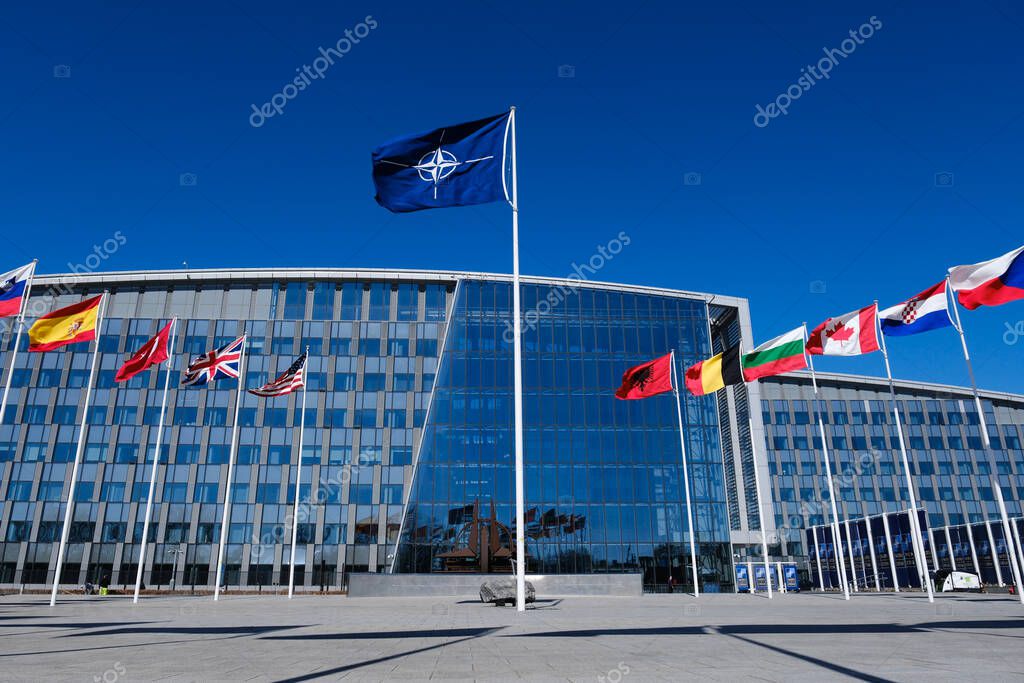 The national flags of countries member of the NATO fly outside the organisation headquarters in Brussels, Belgium on April 3, 2023.