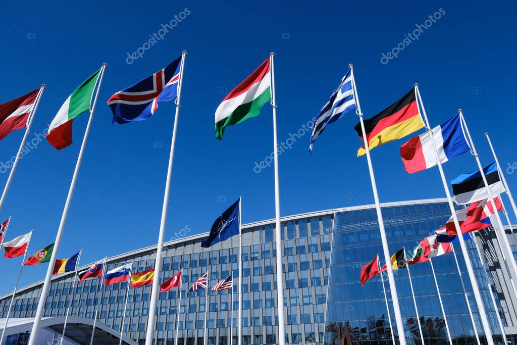 The national flags of countries member of the NATO fly outside the organisation headquarters in Brussels, Belgium on April 3, 2023.