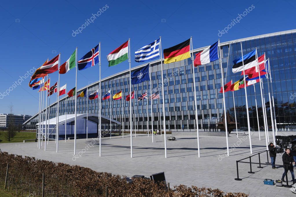 The national flags of countries member of the NATO fly outside the organisation headquarters in Brussels, Belgium on April 3, 2023.