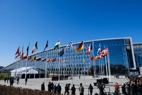 stock image The flag of Finland is hoisted in front of NATO Headquarters during the NATO accession ceremony for Finland in Brussels, Belgium on April 4, 2023.