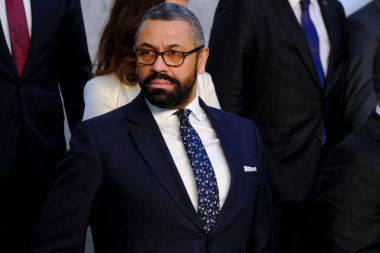 UK Secretary James Cleverly arrives for a family photograph during the North Atlantic Council Ministers of Foreign Affairs meeting in Brussels, Belgium on April 5, 2023. clipart