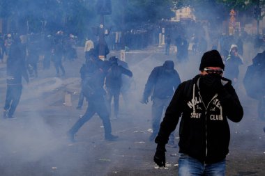 Riot Police clashed with protesters on the sidelines of the annual May Day (Labour Day) rally, marking International Workers' Day, in Paris on May 1, 2023.  clipart