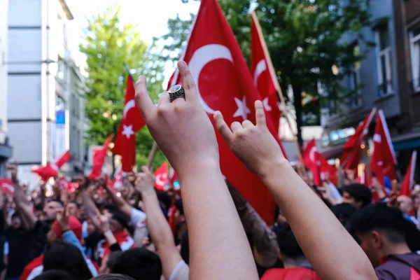 stock image Supporters of Turkish President Erdogan celebrate after the results of the runoff election in Brussels, Belgium on May 28, 2023.