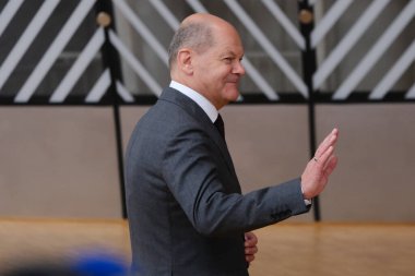 Germany's Chancellor Olaf Scholz speaks to the press as he arrives to attend a European Union Summit with all 27 EU leaders at The European Council Building in Brussels, Belgium, 29 June 2023.  clipart