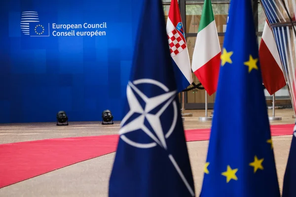 stock image Flag of European Union and flag of NATO in European Headquarters in Brussels, Belgium on June 29, 2023.