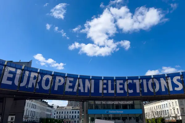 stock image A giant poster announcing the upcoming European elections, stucks on the facade of the European Parliament building in Brussels, Belgium on April 10, 2024.