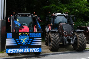 European farmers use tractors during a protest of European farmers over price pressures, taxes and green regulation in Brussels, Belgium June 4, 2024 clipart