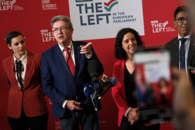 LFI party founder Jean-Luc Melenchon speaks next to European MPs Manon Aubry (R) and Marina Mesure (L) during a press conference the European Parliament in Brussels, Belgium on July 10, 2024. clipart