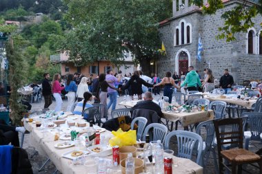 People take part in festivities as they dance traditional folks dances during a festival in Lefka or Paloukova village in Greece on July  27, 2024. clipart