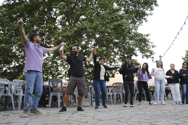 stock image People take part in festivities as they dance traditional folks dances during a festival in Lefka or Paloukova village in Greece on July  27, 2024.