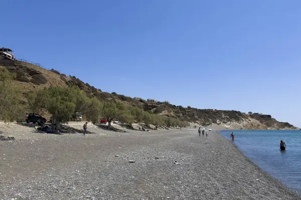 stock image  People enjoy the sea during a hot day in sandy beach of Tsoutsouros, Greece on August 11, 2024. 