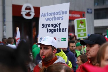 Workers and trade unions take part in a demonstration in support of Audi workers after Volkswagen warned it may close the Brussels site of its luxury brand Audi in Brussels, Belgium September 16, 2024 clipart