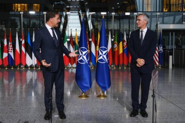 NATO's new Secretary General Mark Rutte and outgoing Secretary  Jens Stoltenberg during a press conference during a handover ceremony at NATO headquarters in Brussels, Belgium on October 1, 2024. clipart