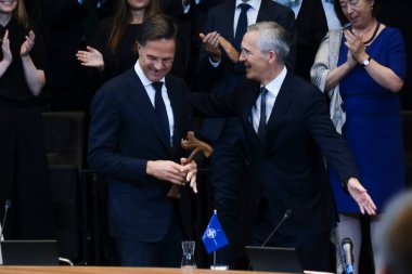 NATO's new Secretary General Mark Rutte and outgoing NATO Secretary General Jens Stoltenberg during a handover ceremony at NATO headquarters in Brussels, Belgium on October 1, 2024.  clipart