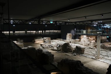 People view antiquities at Venizelou metro station in Thessaloniki, Greece, on January 4, 2025. clipart