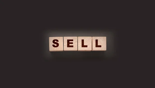Wooden Cubes Word Sell Dark Background Shopping Concept — Stock Photo, Image