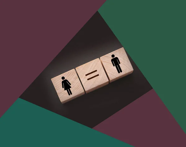 Concepts of gender equality. wooden cubes with female and male symbol and equal sign. Equal pay social quaranty concept.