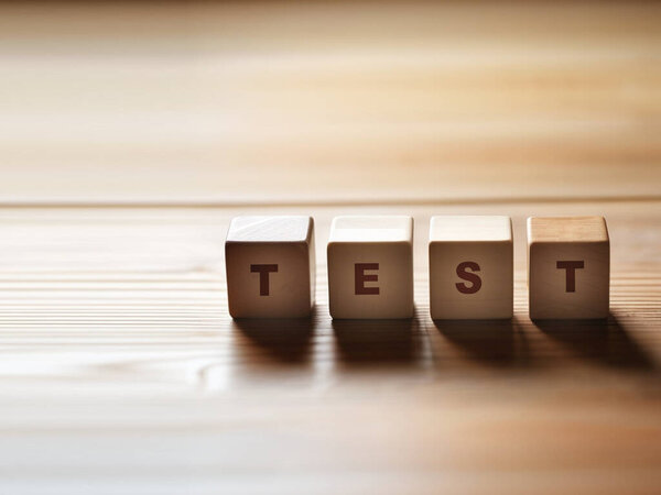 wooden blocks with letters on the text test.