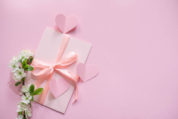 Spring bouquet of flowers on a pink background.