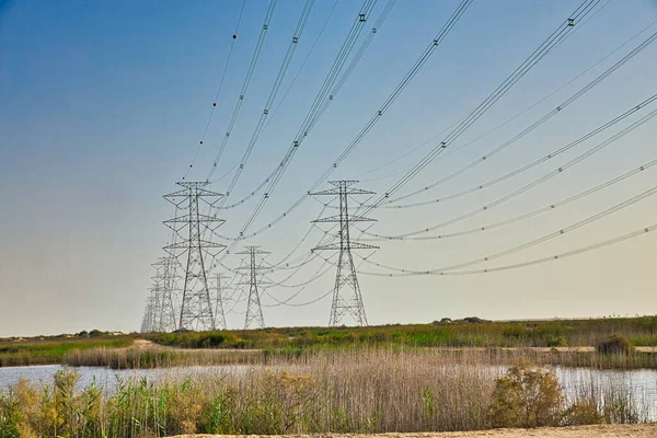 stock image High Power Electric transmission grid lines in the desert.Dammam -Saudi Arabia.