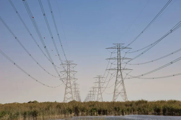 stock image High Power Electric transmission grid lines in the desert.Dammam -Saudi Arabia.