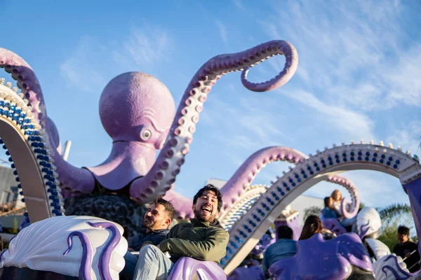 stock image Couple of latin friends having fun in an amusement park