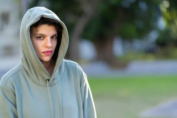 stock image Woman with short hair and masculine appearance and serious look wearing a hoodie