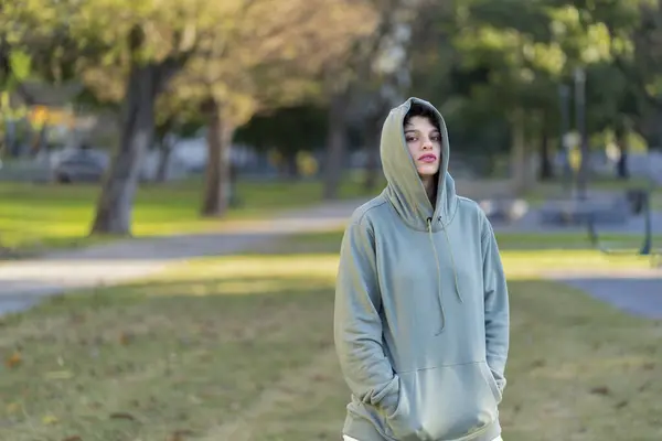 stock image Woman with short hair and masculine appearance and serious look wearing a hoodie