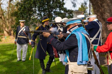 San Isidro, Buenos Aires Province, Argentina - 21 September 2024: Actors perform a representation of the Argentine civil war between unitarians and federalists between 1828 and 1931 clipart