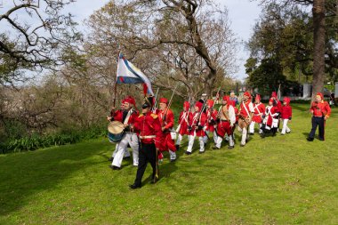 San Isidro, Buenos Aires Province, Argentina - 21 September 2024: Actors perform a representation of the Argentine civil war between unitarians and federalists between 1828 and 1931 clipart