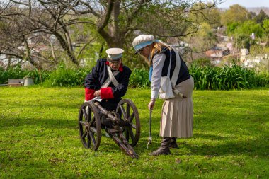 San Isidro, Buenos Aires Province, Argentina - 21 September 2024: Actors perform a representation of the Argentine civil war between unitarians and federalists between 1828 and 1931 clipart