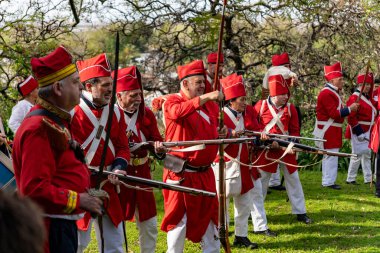 San Isidro, Buenos Aires Province, Argentina - 21 September 2024: Actors perform a representation of the Argentine civil war between unitarians and federalists between 1828 and 1931 clipart