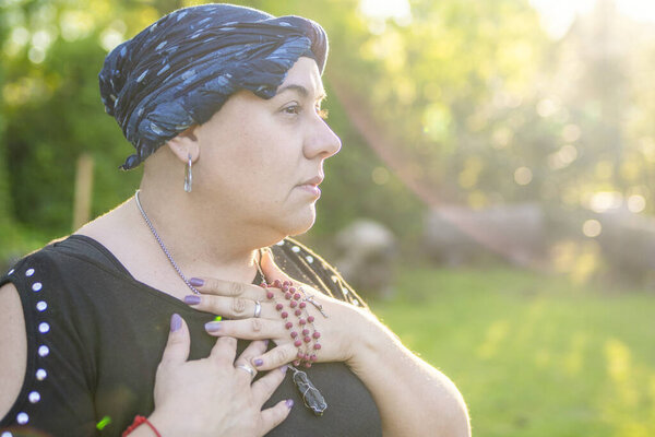 Contemplative female cancer fighter finding solace in the golden light of sunset