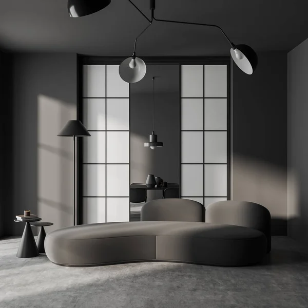 Dark living room interior with sofa and meeting area with table behind doors, grey concrete floor. Relaxing zone with couch and minimalist decoration. 3D rendering
