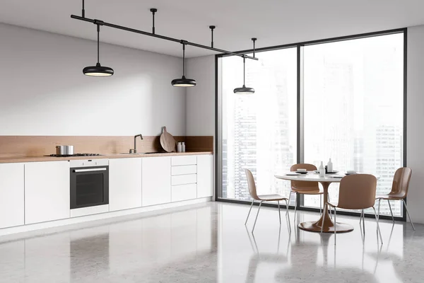 ダイニングテーブル パノラマウィンドウ 白い壁 コンクリート床 シンク オーブン ガス炊飯器付きの明るい現代的なキッチンルームのインテリアのコーナービュー ミニマルデザインのコンセプト 3Dレンダリング — ストック写真