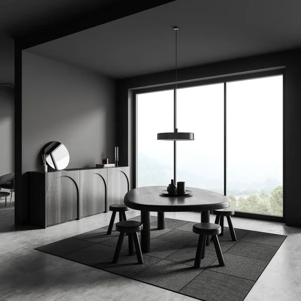Dark living room interior with dining table and stool, side view, drawer with decoration. Panoramic window on countryside. Mockup copy space wall. 3D rendering