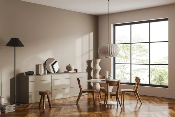 stock image Beige living room interior with dining table and chairs, side view drawer with decor on hardwood floor. Panoramic window on tropics. Mockup empty wall. 3D rendering