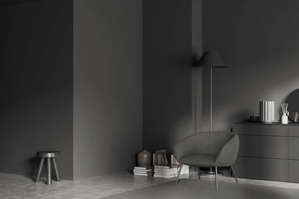 Corner view on dark living room interior with armchair, sideboard, round mirror, crockery, books, stool, grey wall, concrete floor. Concept of minimalist design. Place for meeting. 3d rendering