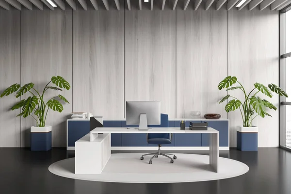 Front view on bright office room interior with desktop, desk, armchair, panoramic window with city view, concrete floor, carpet, sideboard. Concept of company, firm, director workspace. 3d rendering