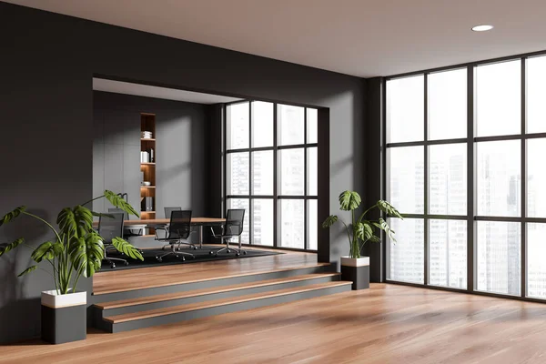 Corner view on dark office room interior with armchairs, meeting board, panoramic window, oak wooden floor, plants, podium, wardrobe. Concept of company, firm, meeting space. 3d rendering