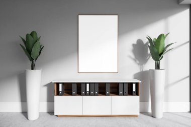 White office interior with sideboard and folders in row, front view plant decoration on grey concrete floor. Mock up canvas poster on wall. 3D rendering