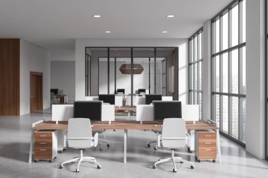 Side view on bright office room interior with computers, desks, armchairs, panoramic window with skyscraper view, concrete floor. Concept of company, firm, meeting space. 3d rendering